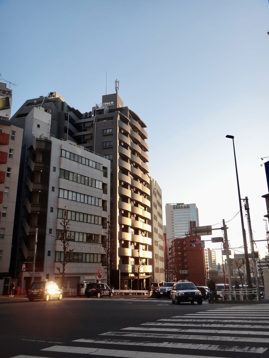 Photo by 천우희 on April 03, 2026. May be an image of skyscraper, cloud, street, road, twilight, tower, buildings and text.