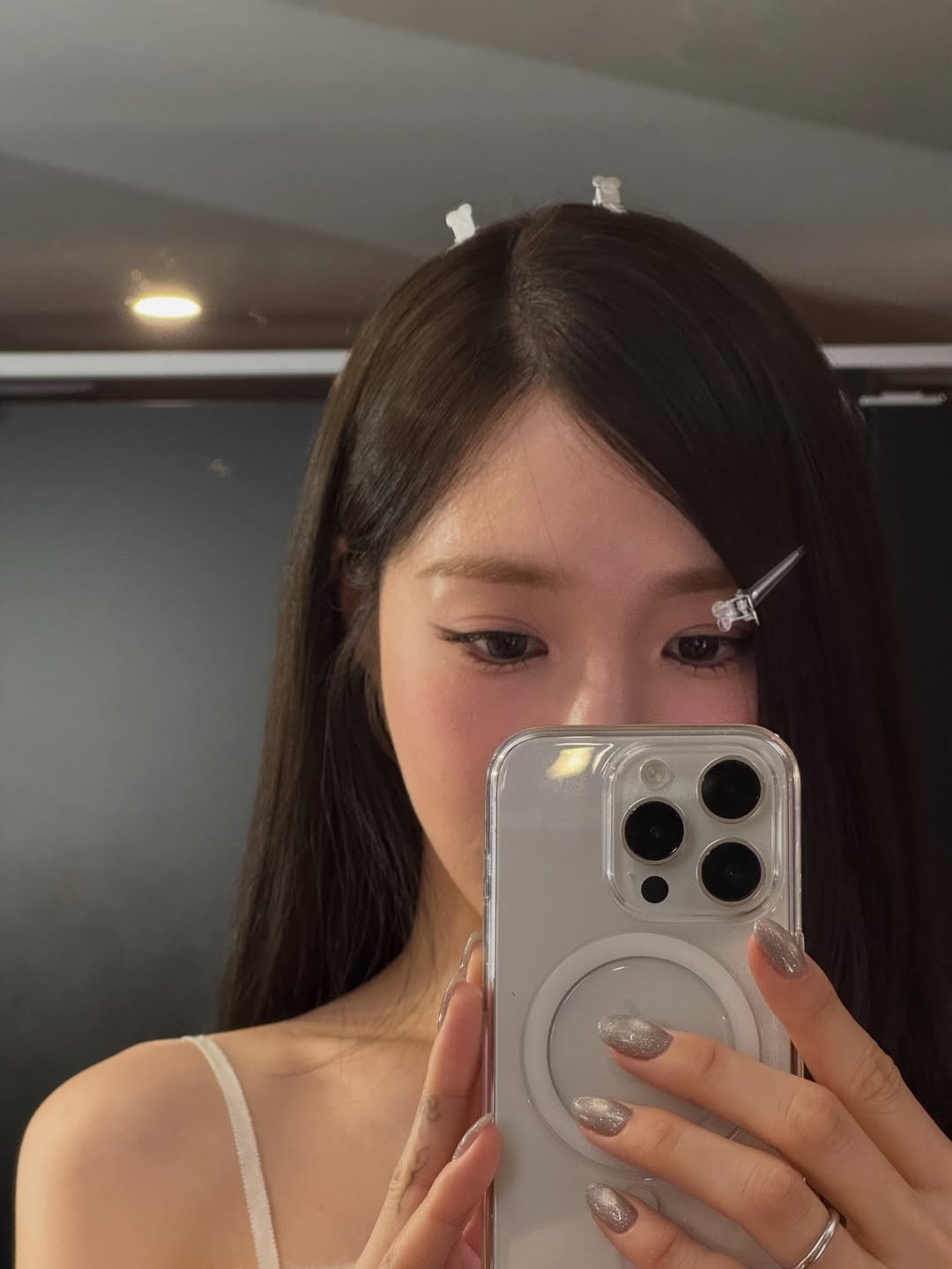 Photo by tiffany young on February 05, 2026. May be a selfie of one or more people, hair, phone, mirror, top and text.