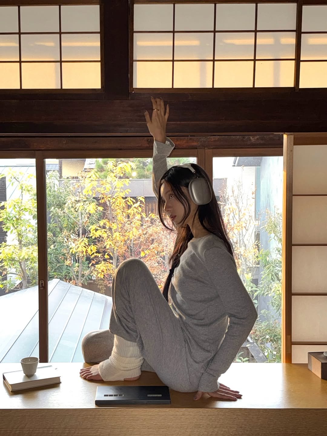 Photo by 티슈 on December 22, 2025. May be an image of sleepwear, bath robe, robe, portable cassette player and text.