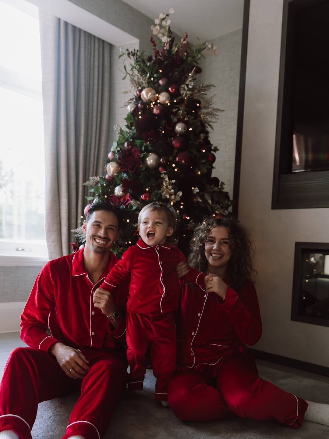 Photo shared by Marina Reijnders Gourgis on December 25, 2025 tagging @tijjanireijnders. May be an image of sleepwear, christmas tree, bath robe and text.