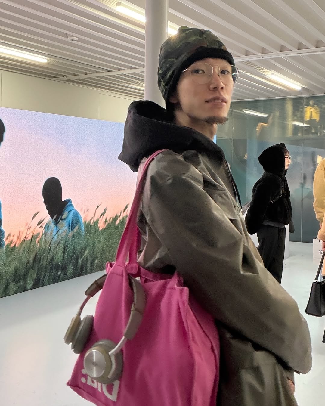 Photo shared by Hikaru Toma/ブリーチパーマ/パーマ/似合わせカット on December 05, 2025 tagging @gucci, @bangolufsen, and @skylrk. May be an image of standing, duffle coat, overcoat, sling, parka, portable cassette player and text.