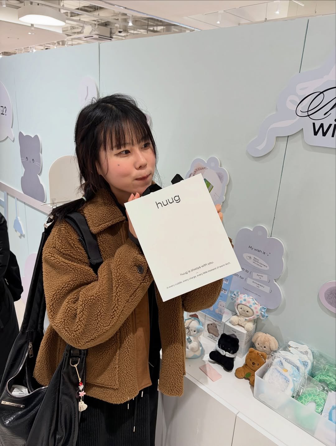 Photo shared by 늘헤 on January 01, 2026 tagging @huug.official. May be an image of duffle coat and text.