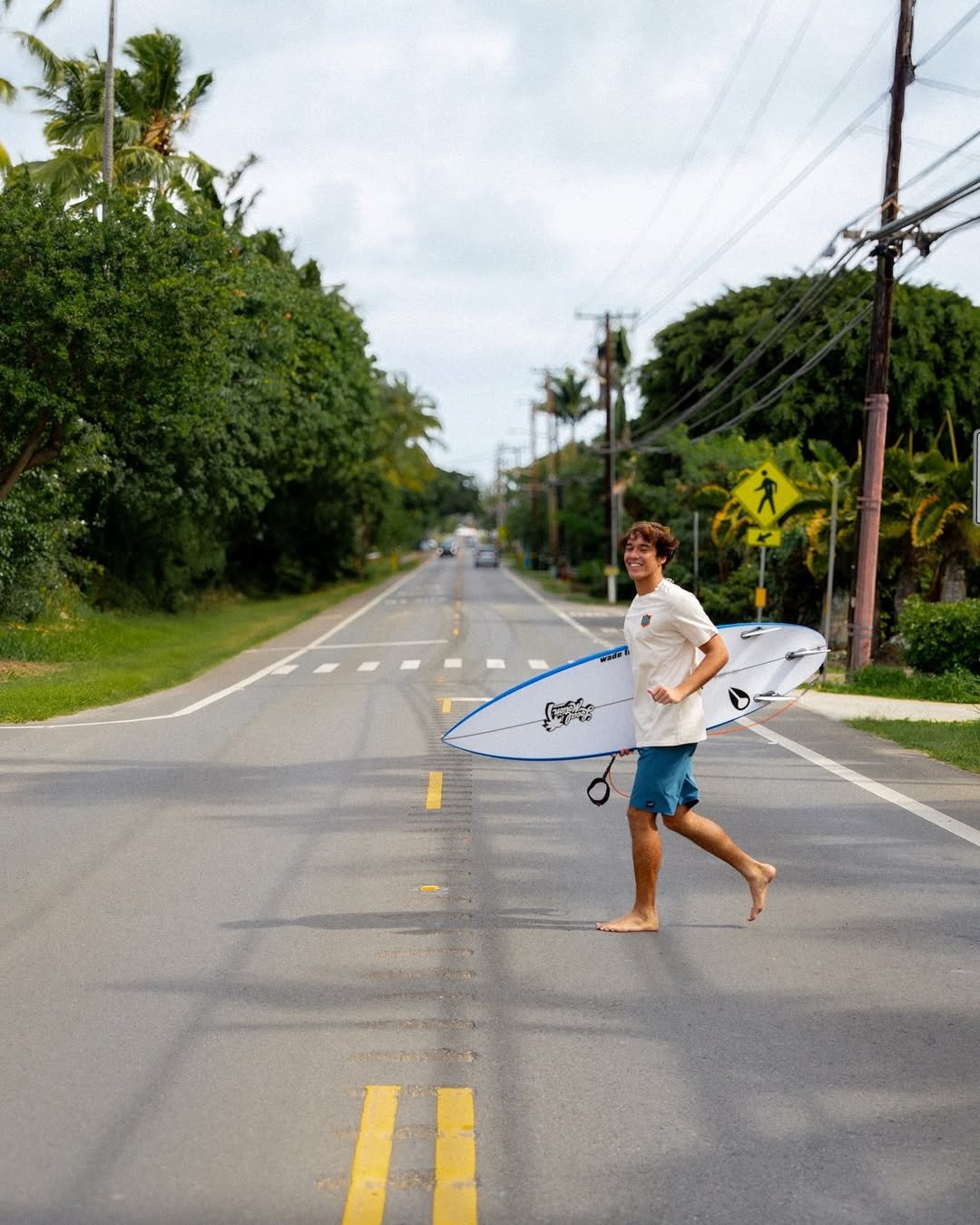 Photo shared by Local Motion Hawaii on March 27, 2026 tagging @tokorosurfboards, and @kainalu.mccormick. May be an image of skateboard, surfboard, wetsuit, water, road and text.