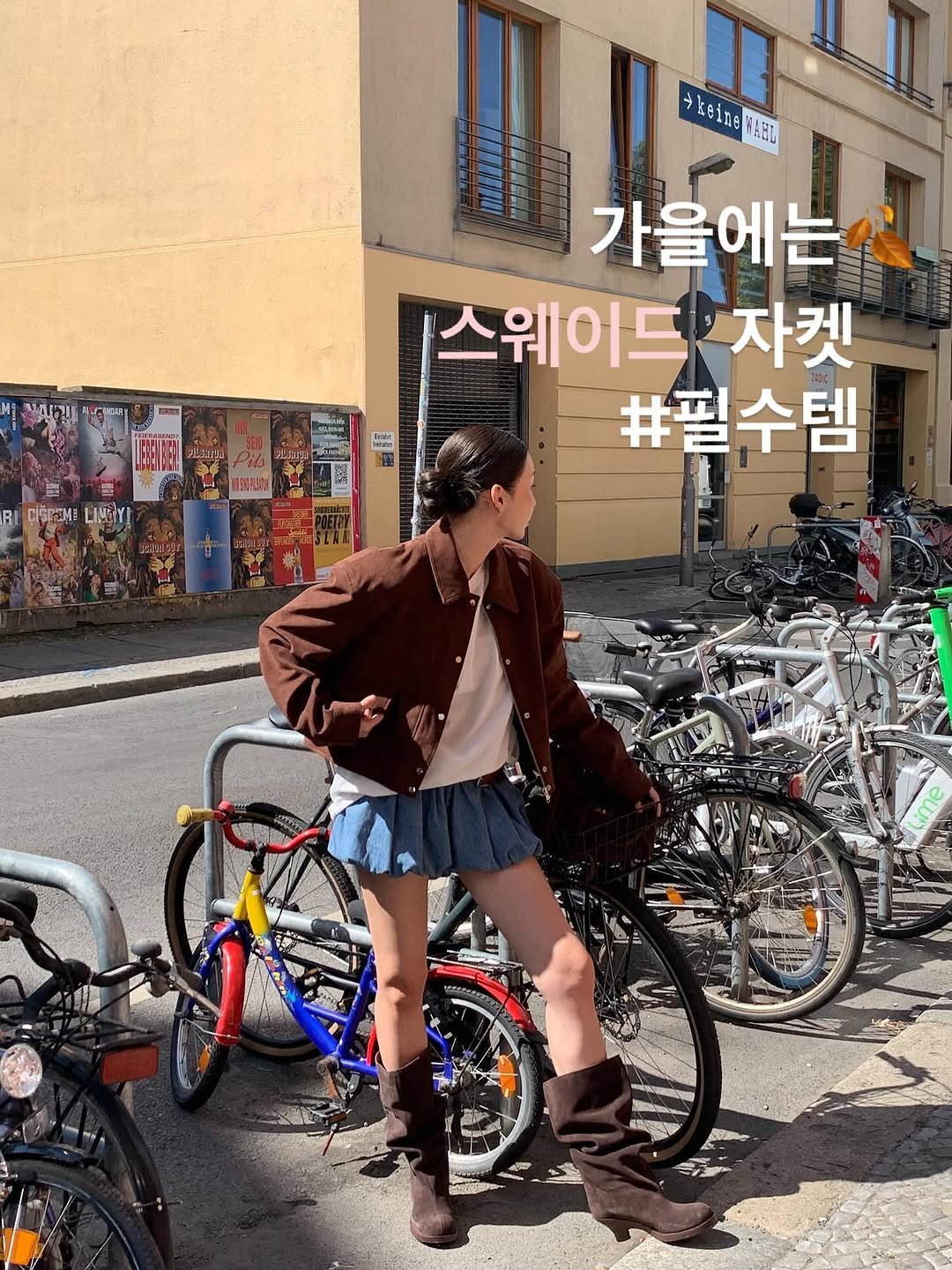 Photo by 톰걸 TOMGIRL on September 17, 2025. May be an image of 1 person, duffle coat, bicycle and text.