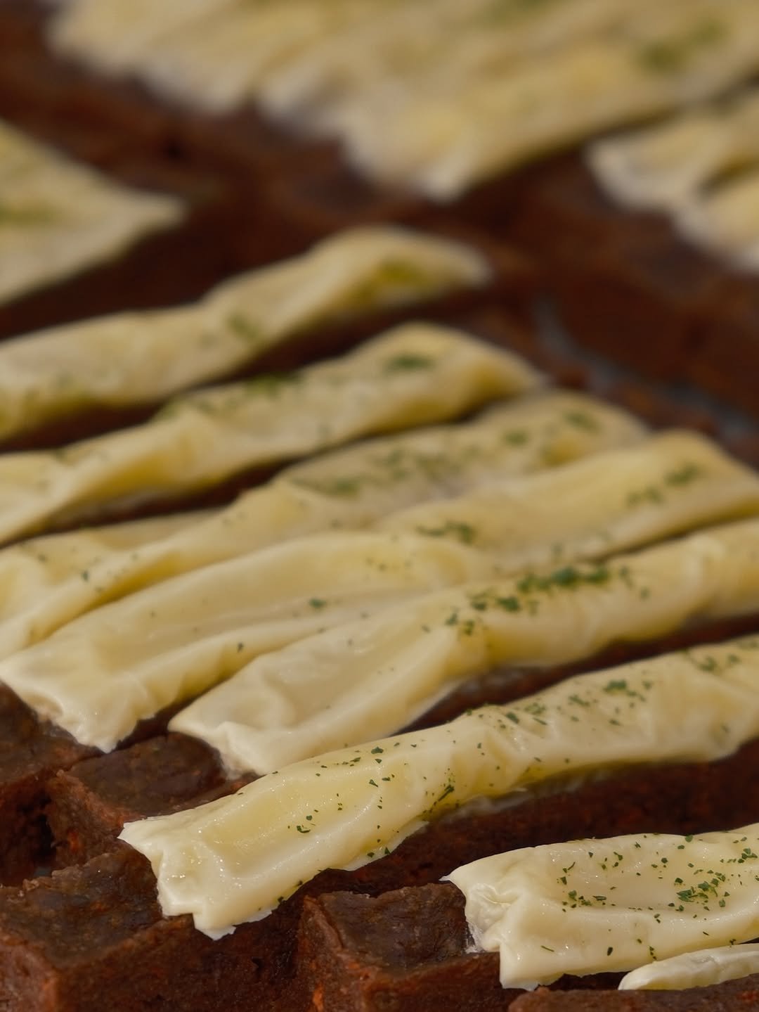 Photo shared by 톰리프 (Tomlif) on December 30, 2025 tagging @tomlif_official. May be an image of rye bread, cream cheese, baked goods, butter, toast and text.