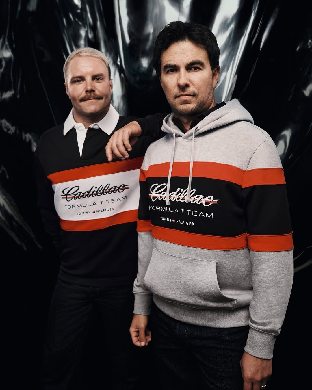 Photo shared by Tommy Hilfiger on April 01, 2026 tagging @schecoperez, @valtteribottas, and @cadillacf1. May be an image of sweatshirt, parka, sweater and text that says 'Cactillae N FORMULATTEAM FORMULA HILFIGER TTEAM Cadilae FORMULA 1TEAM 1 TOMMYZHILFIGER TOMMY TOMMY- HILFIGER TOMMY-HILFIGER FORMULATTEAM HILF'.