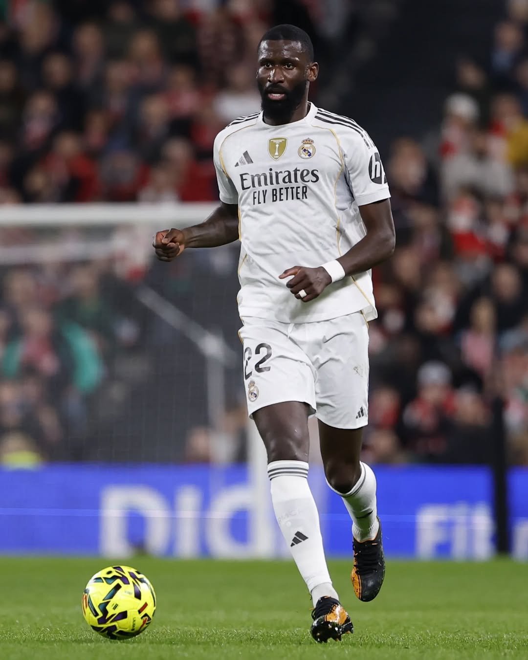 Photo by Antonio Rüdiger on December 03, 2025. May be an image of football, soccer, cleats, stadium and text that says 'Emirates FLYBETTER FLY BETTER 2 2 nic 外'.