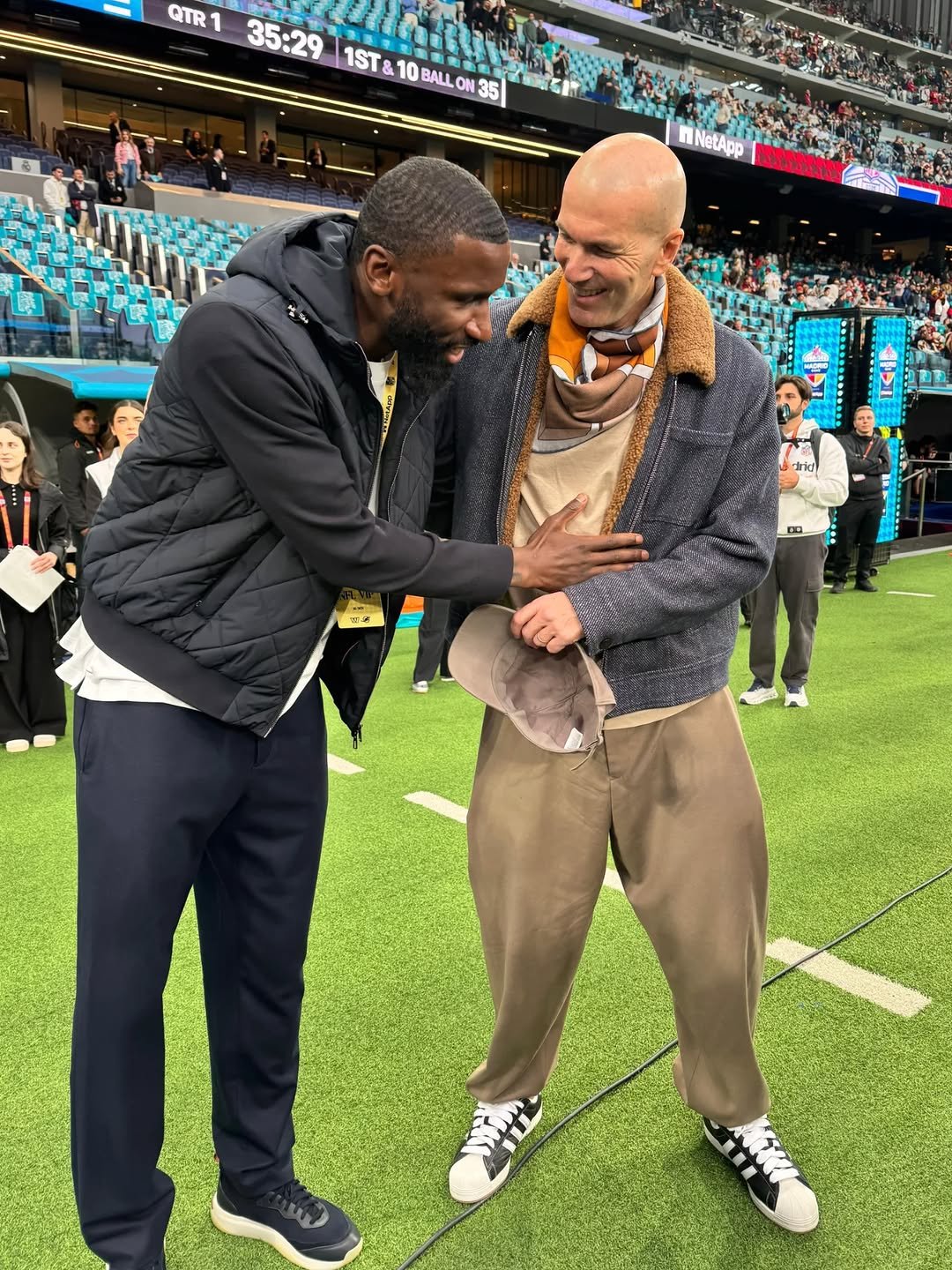 Photo shared by Antonio Rüdiger on November 16, 2025 tagging @zidane. May be an image of football, standing, turtleneck, stadium and text that says 'QTR 1 35:29 1ST& 10 1ST&10BALLON35 BAL O N: 35 BALL nNetApp M好 iric'.