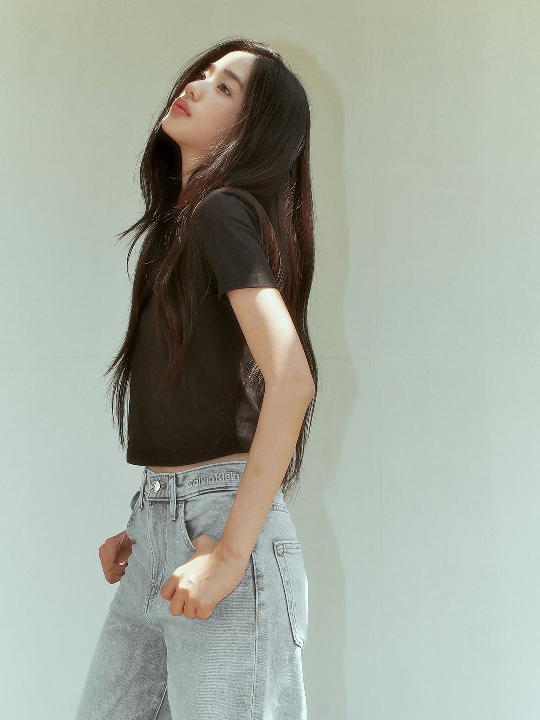 Photo shared by ตู / t u on April 17, 2026 tagging @calvinklein. May be an image of one or more people, braids, sweatpants and text.