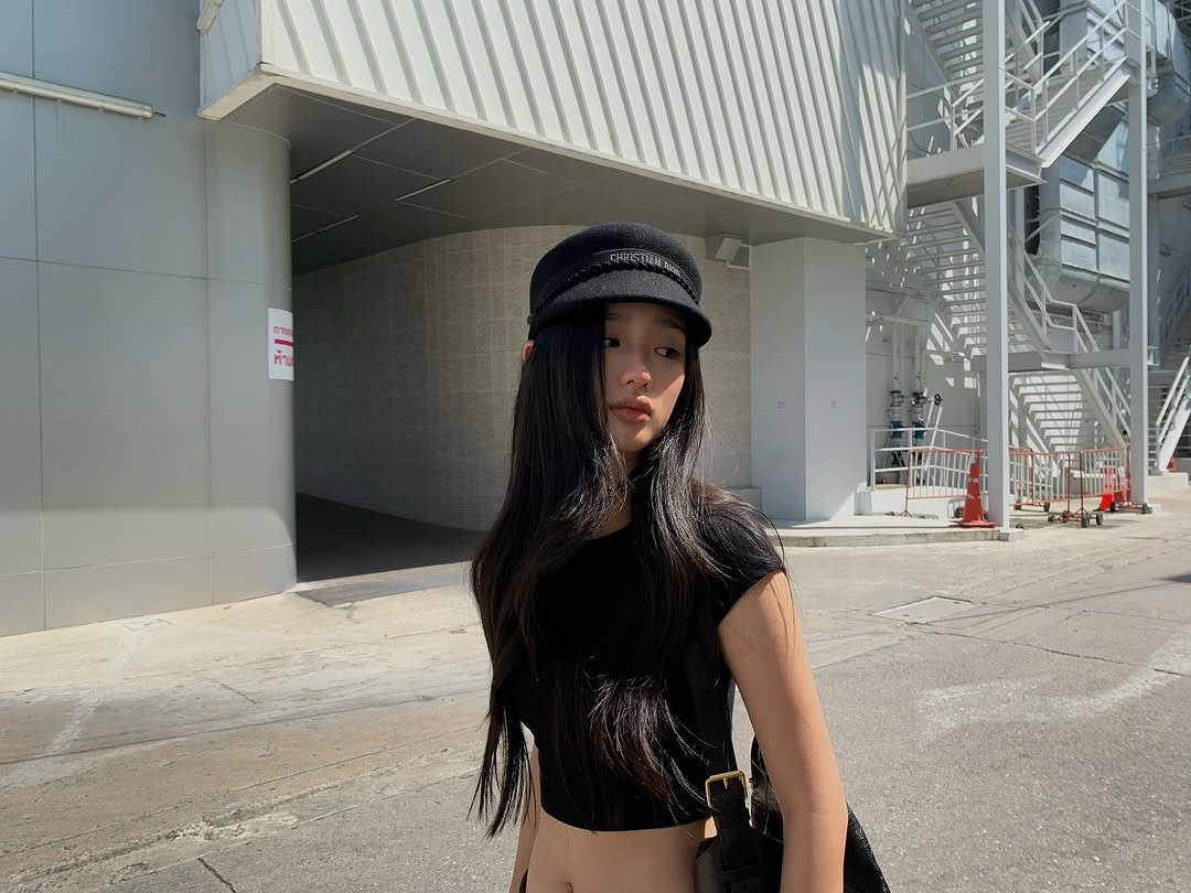 Photo by ตู / t u on November 15, 2025. May be an image of hat, fishnet stockings, beret and text.