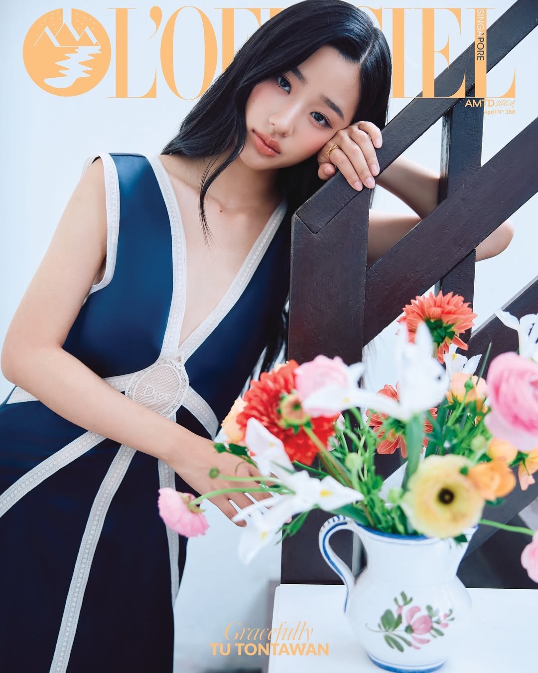 Photo shared by L’OFFICIEL SINGAPORE on April 07, 2026 tagging @tontawan, and @dior. May be an image of one or more people, hair, makeup, magazine and text that says 'ΥΙου I AM AMTDCA () prf rliN"138 II 188 Gracefully TU TONTAWAN ΟΝ TAWAN'.