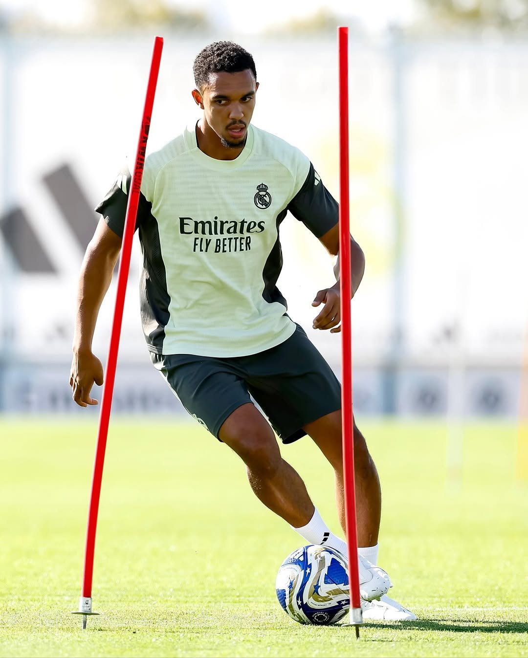 Photo shared by Trent Alexander-Arnold on October 15, 2025 tagging @realmadrid. May be an image of football, soccer, cleats, sports equipment, ball, stadium and text that says 'Emirates FLY BETTER'.