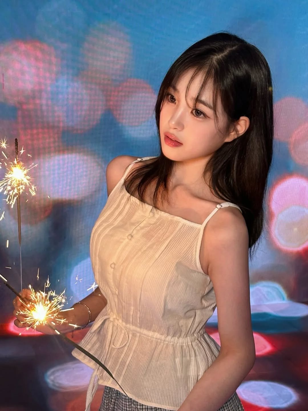 Photo shared by tripleS HOUSE on March 30, 2026 tagging @triplescosmos. May be an image of one or more people, hair, sparkler, fireworks and text.