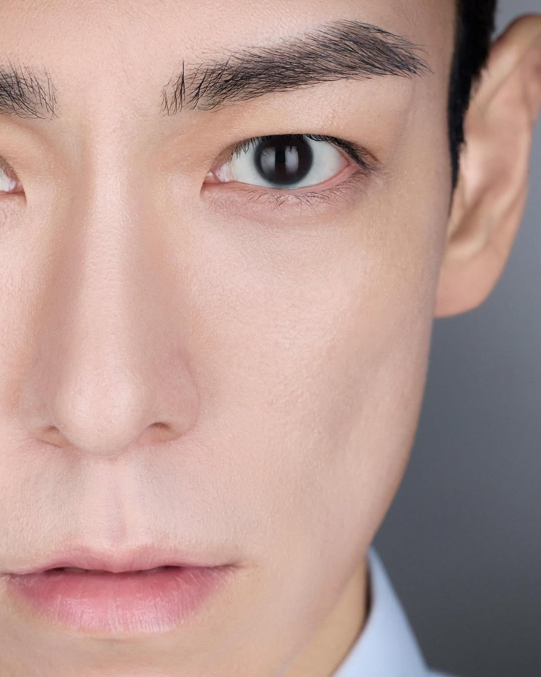 Photo shared by T.O.P on March 19, 2026 tagging @topspot_pictures. May be a closeup of one or more people, makeup, hair and text.