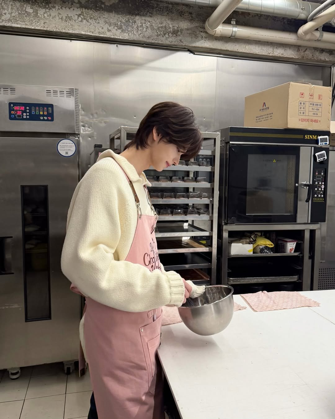 Photo by TWS (투어스) on February 16, 2026. May be an image of apron and text.