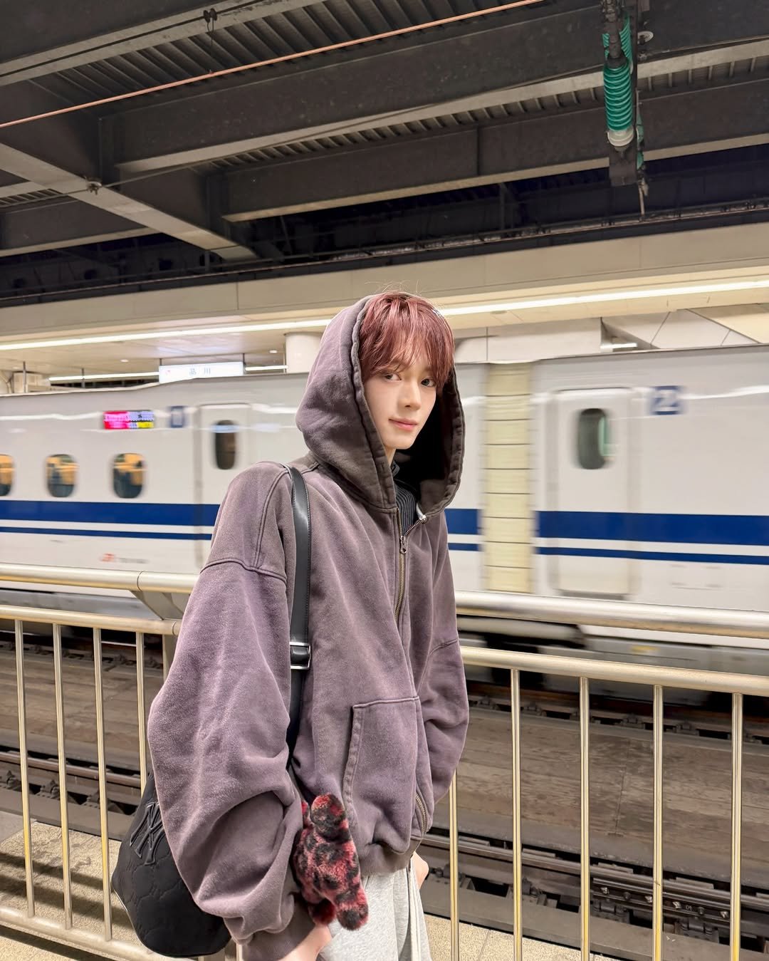 Photo by TWS (투어스) on December 28, 2025. May be an image of train, duffle coat, parka and text.