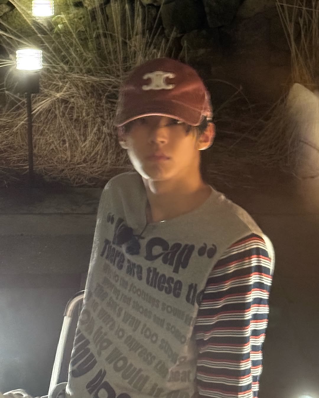 Photo by TWS (투어스) on November 16, 2025. May be an image of one or more people, hat, top, outdoors, night and text.