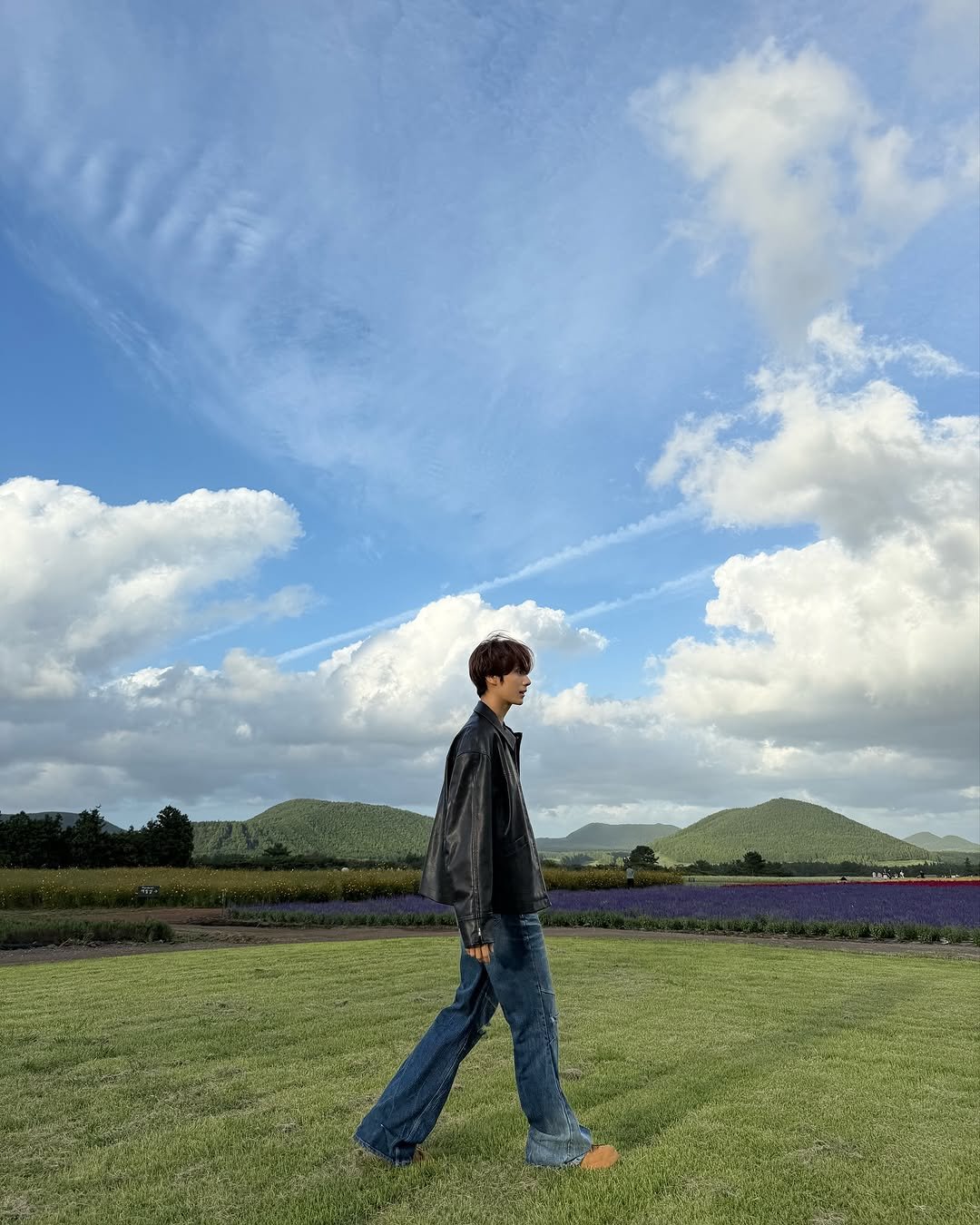 Photo by TWS (투어스) on November 16, 2025. May be an image of cloud, grass and text.