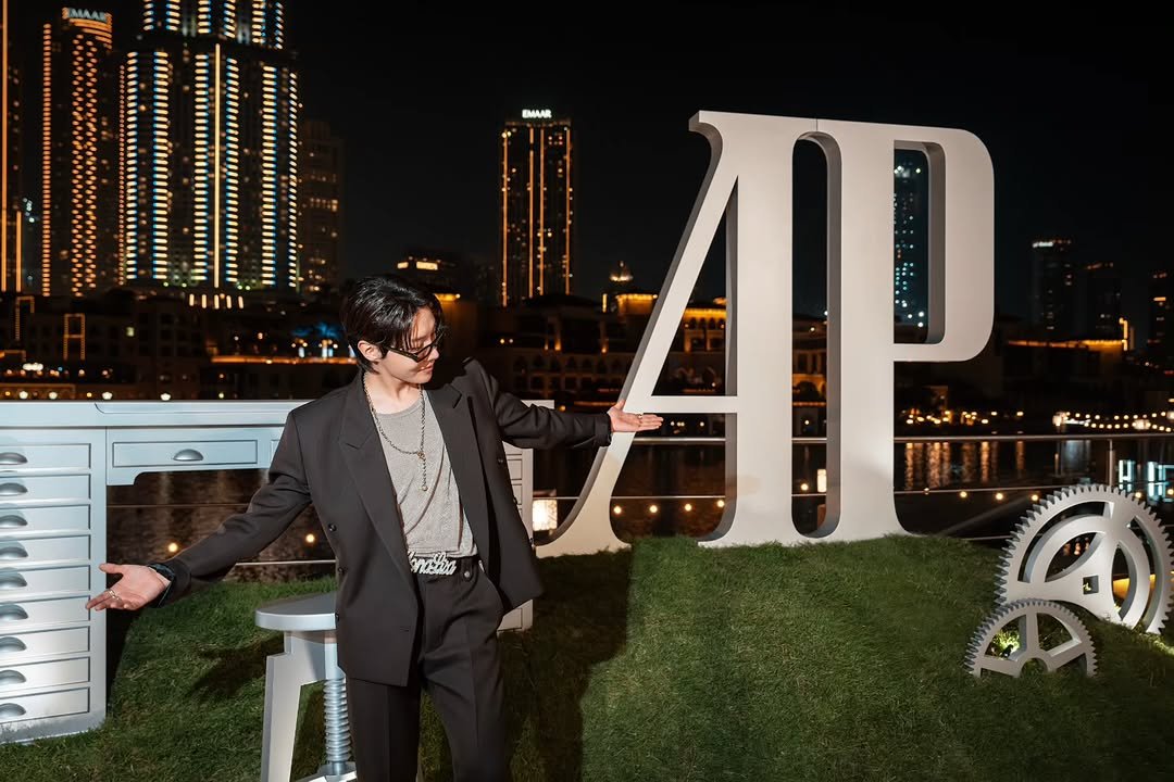 Photo shared by jhope on December 22, 2025 tagging @audemarspiguet. May be an image of suit, outdoors and text.