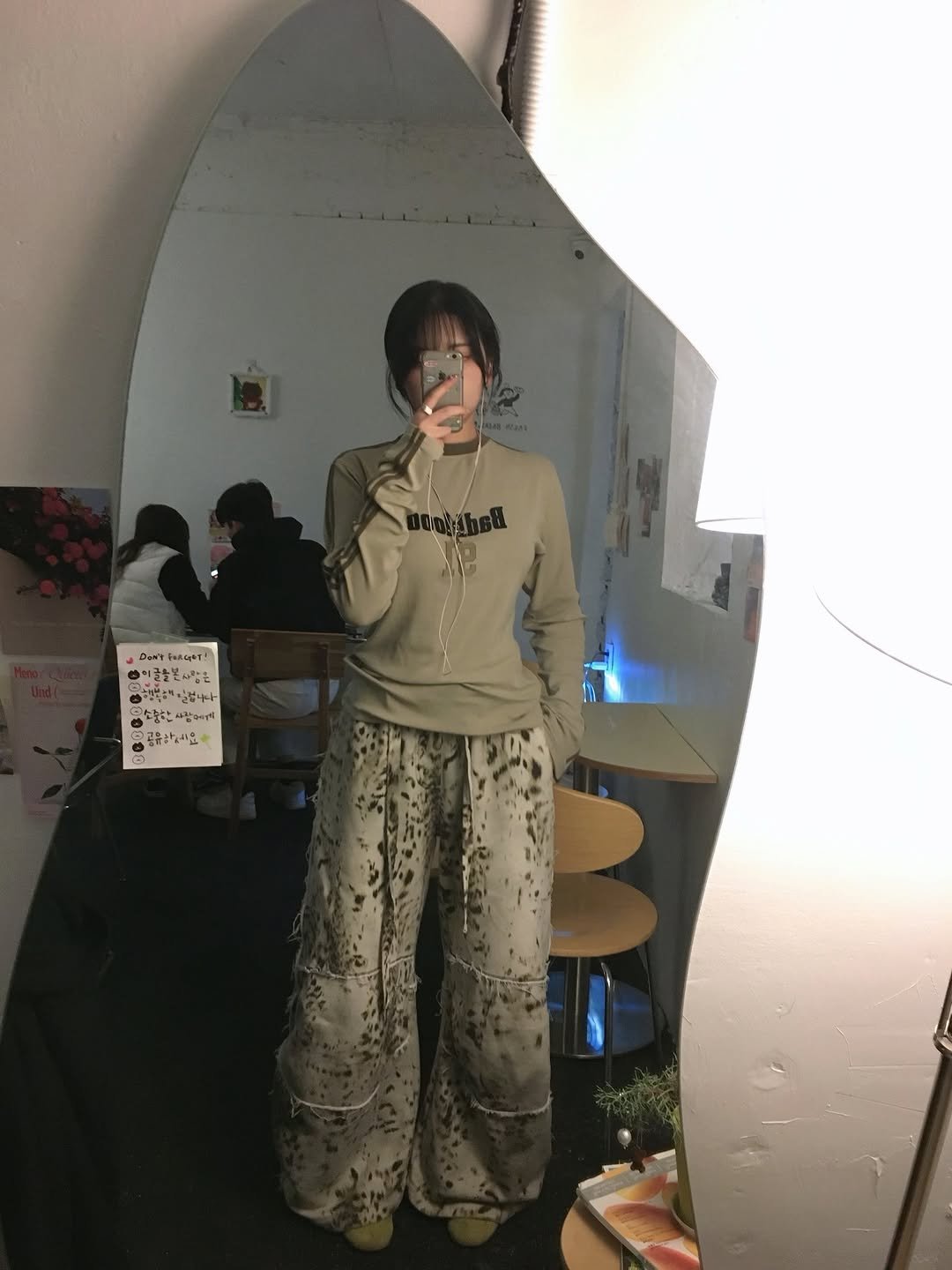 Photo shared by 유빈 on December 31, 2025 tagging @almost.blue, @onitsukatigerkr, and @badblood__official. May be an image of sleepwear, sweatsuit, sweatpants, mirror and text.