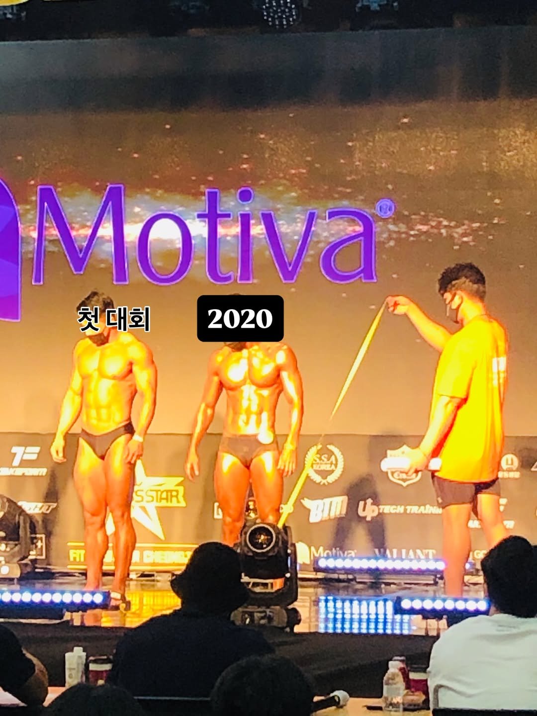 Photo by UK Sang Nam on February 17, 2026. May be an image of ‎one or more people, biceps, people bodybuilding and ‎text that says '‎Motiva® 첫 대회 2020 7= 7= MrENm مكد POA SSTAR BII 4 ИTΗ TRAINI Motiva Mativas.VALIANT VALIANT‎'‎‎.