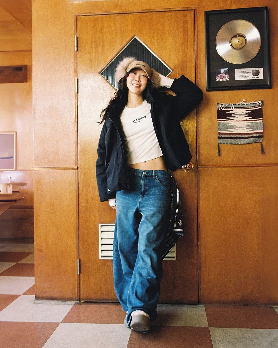 Photo shared by 엄브로 코리아 on December 16, 2025 tagging @gonnyg0nny. May be an image of standing, bandanna, tambourine, portable cassette player and text.