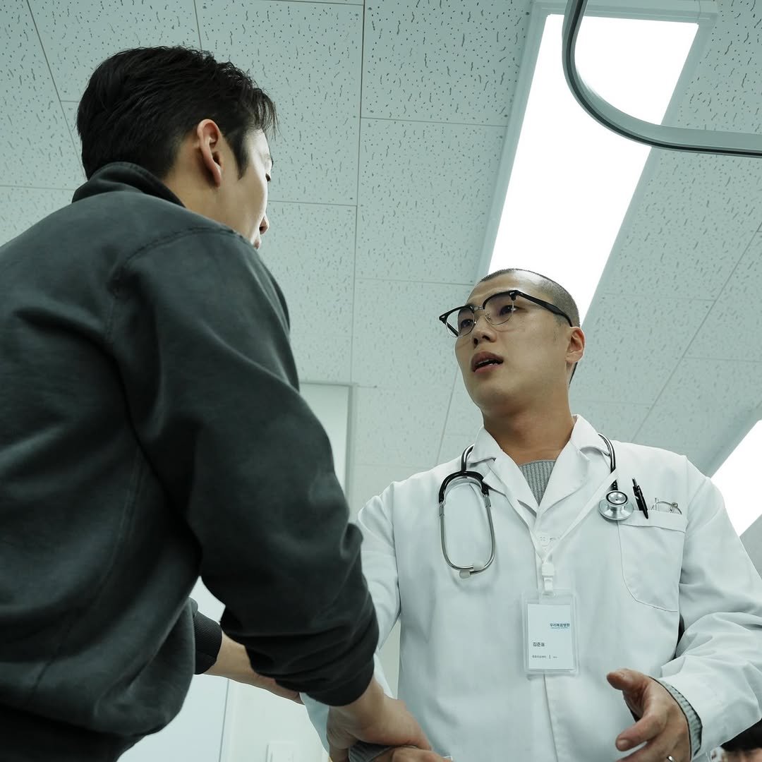 Photo shared by 김준표 on April 23, 2026 tagging @un_expected_film. May be an image of one or more people, people standing, stethoscope, hospital, office and text.