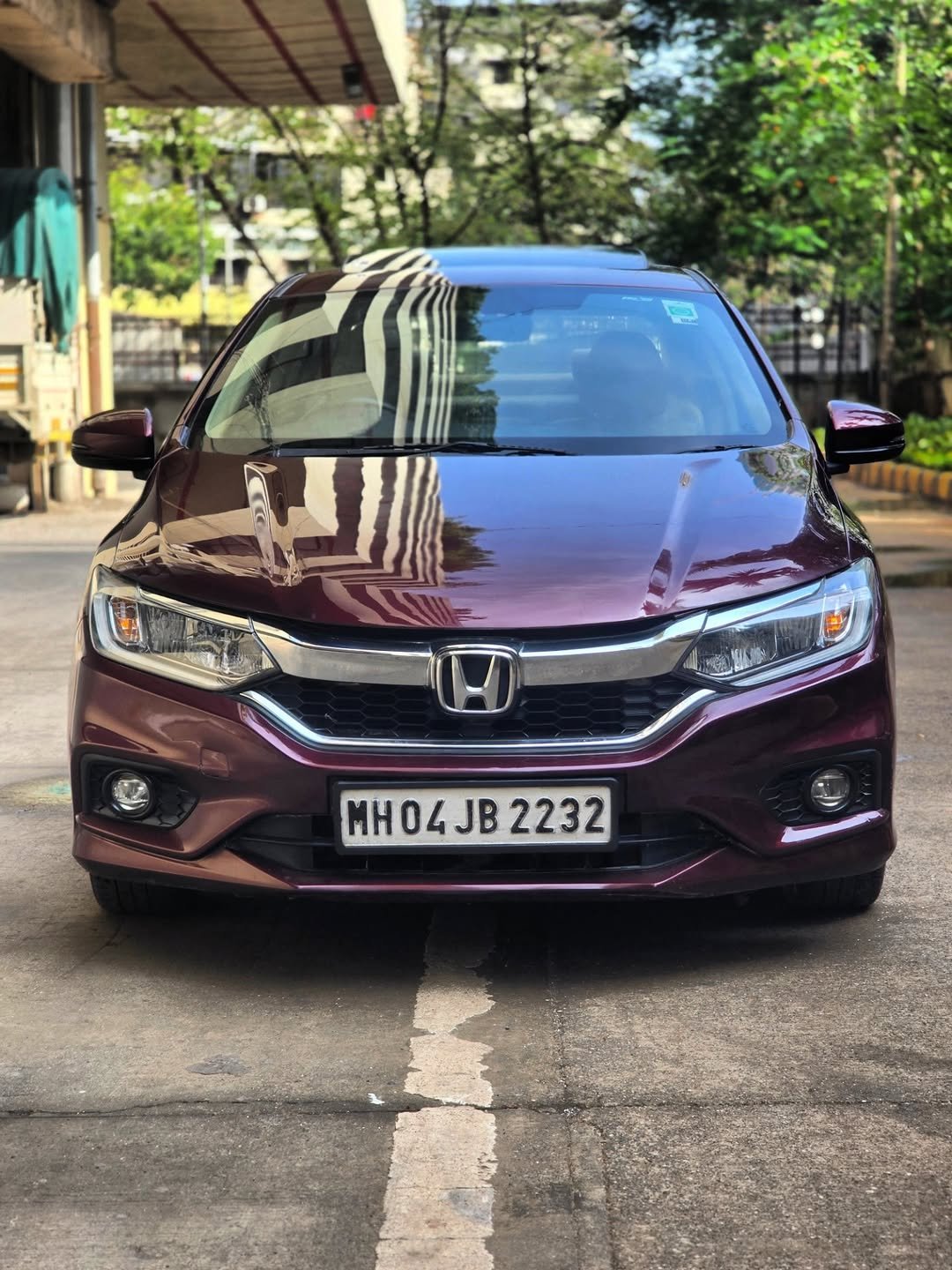 Photo by unicauto on November 05, 2025. May be an image of ‎sedan, windshield and ‎text that says '‎וע MH04JB2232 MHO4 2232‎'‎‎.