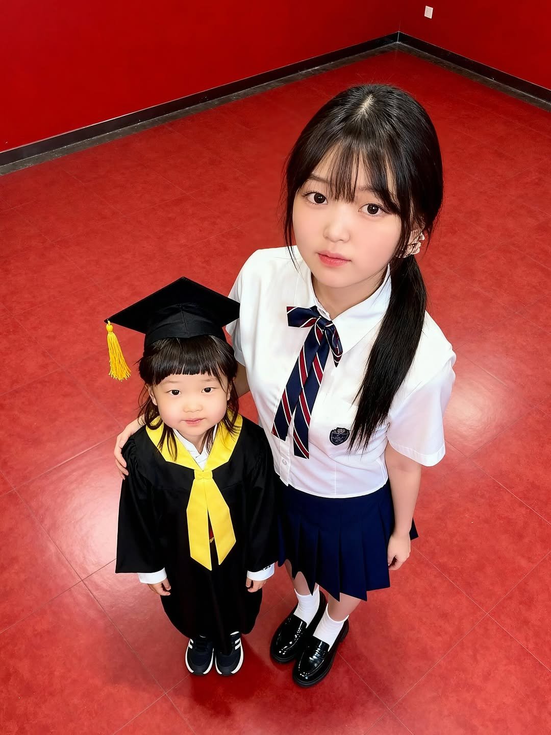 Photo shared by 김윤희 on September 21, 2025 tagging @meitu.kr. May be an image of 2 people, child, costume and text.