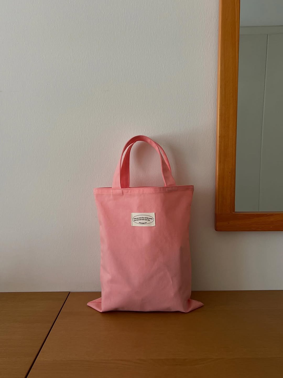 Photo shared by 유 어 메 세 지 on August 13, 2025 tagging @urmessage_. May be an image of tool bag, pouch, sling, grocery bag, drawstring and text.