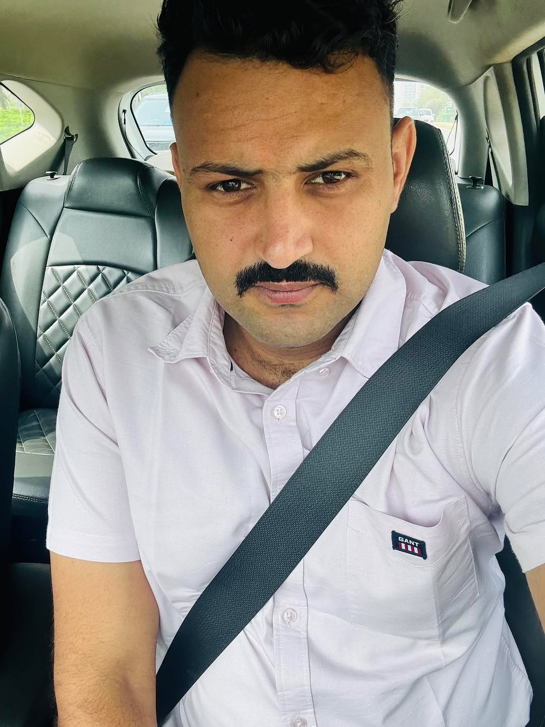 Photo by AMIT YADAV on May 19, 2025. May be a selfie of 1 person, beard, hair, smiling, seatbelt and text.