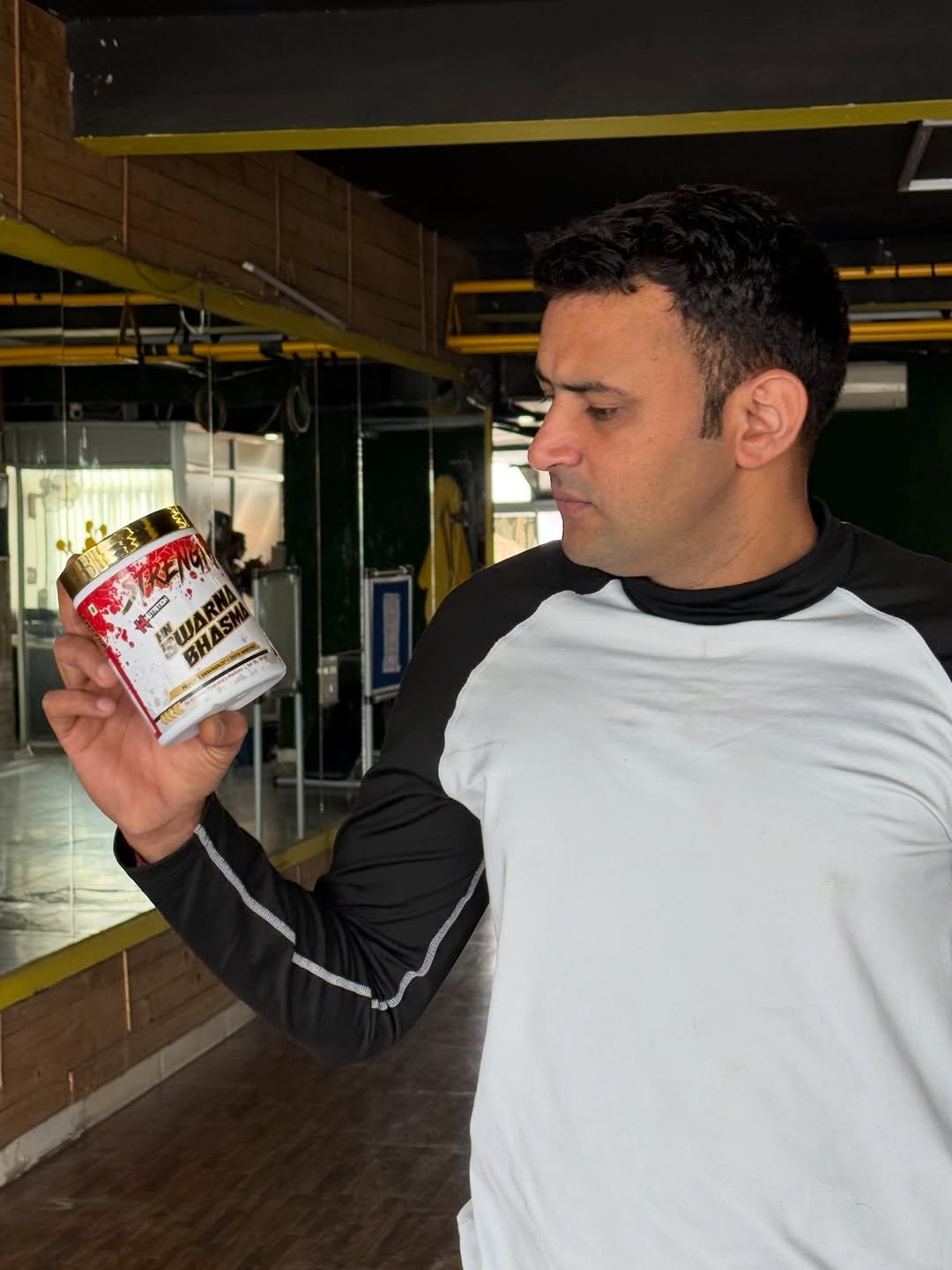 Photo shared by Amit on December 26, 2025 tagging @hoodanutrition_official. May be an image of one or more people, biceps, people bodybuilding, shaker, canister and text.