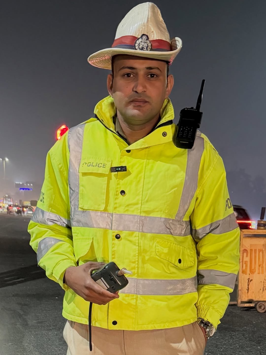 Photo by Amit on December 26, 2025. May be an image of standing, phone, hat, ambulance and text.