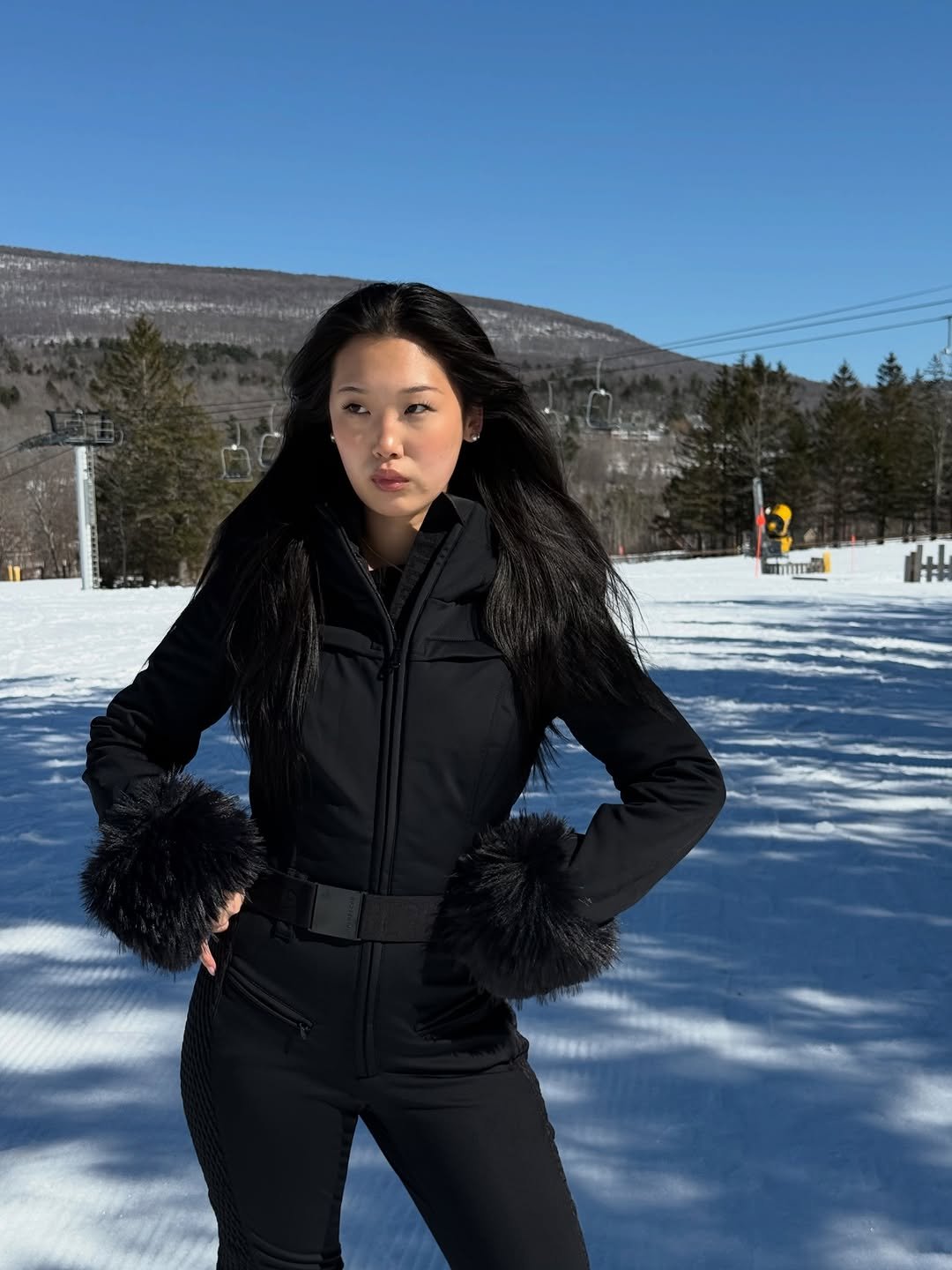 Photo by VIA LI on March 04, 2026. May be an image of fur coat, goosedown coat, ski, snowsuit, parka, ski slope, snow and text.