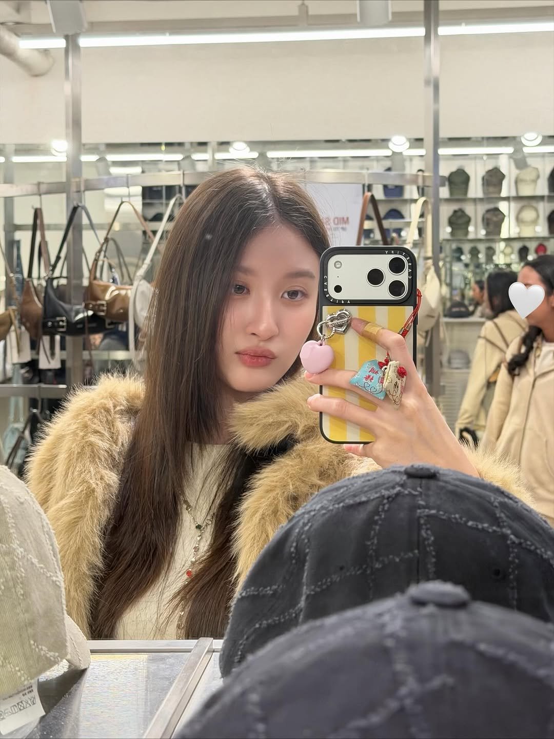 Photo by Benyapa j. on November 01, 2025. May be a selfie of one or more people, hair, phone, hat, goosedown coat, fur, parka, mirror and text.