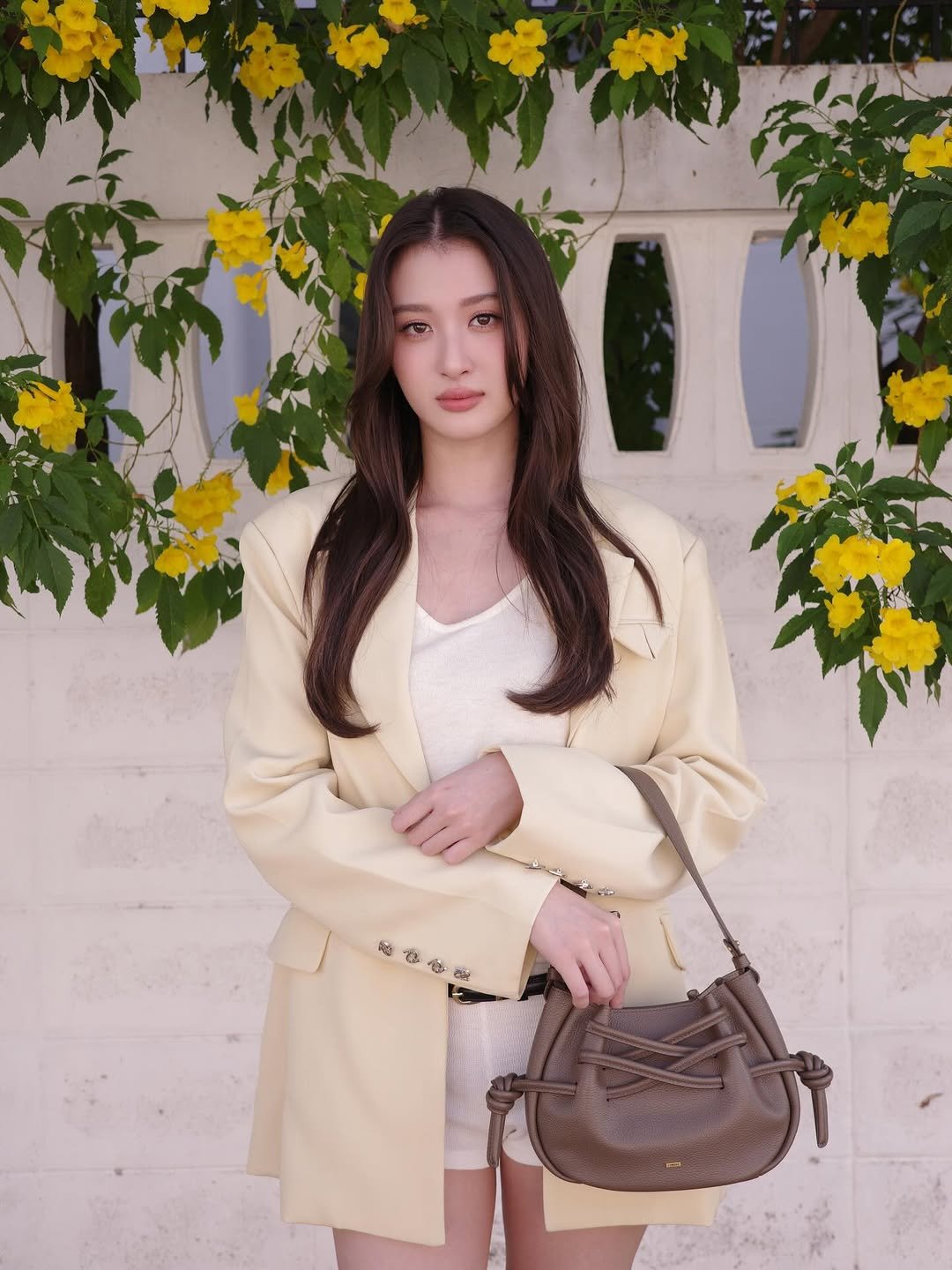 Photo shared by Benyapa j. on January 07, 2026 tagging @fundaoera. May be an image of purse, blazer, yellow jessamine and text.