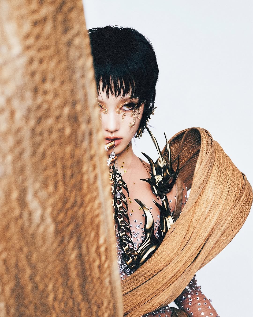 Photo by 박은빈 Park Eunbin on September 19, 2025. May be an image of one or more people, makeup, fishnet stockings, magazine and text.