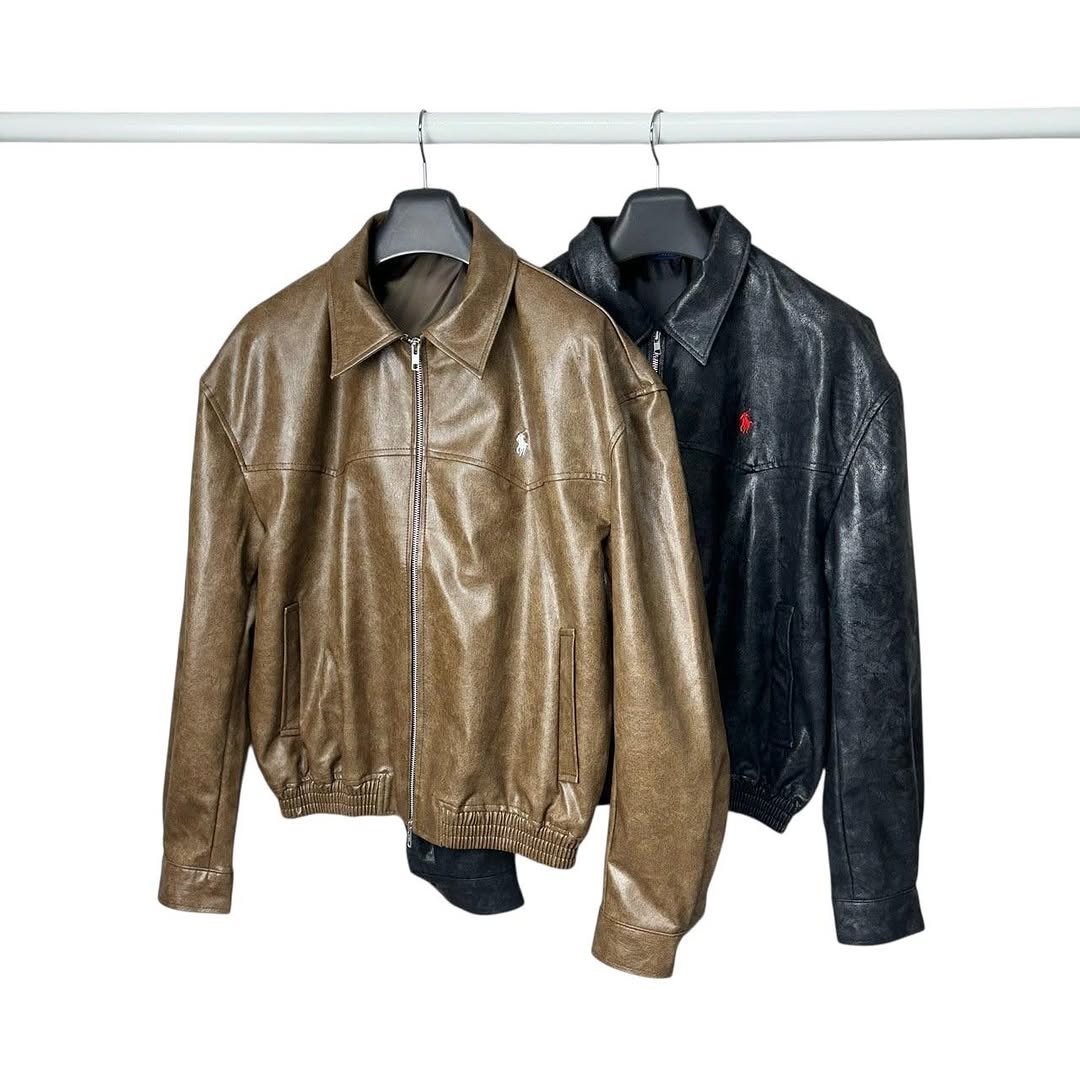 Photo by vintage_company._ on December 04, 2025. May be an image of leather, coat, clothes hanger, flight jacket and text.