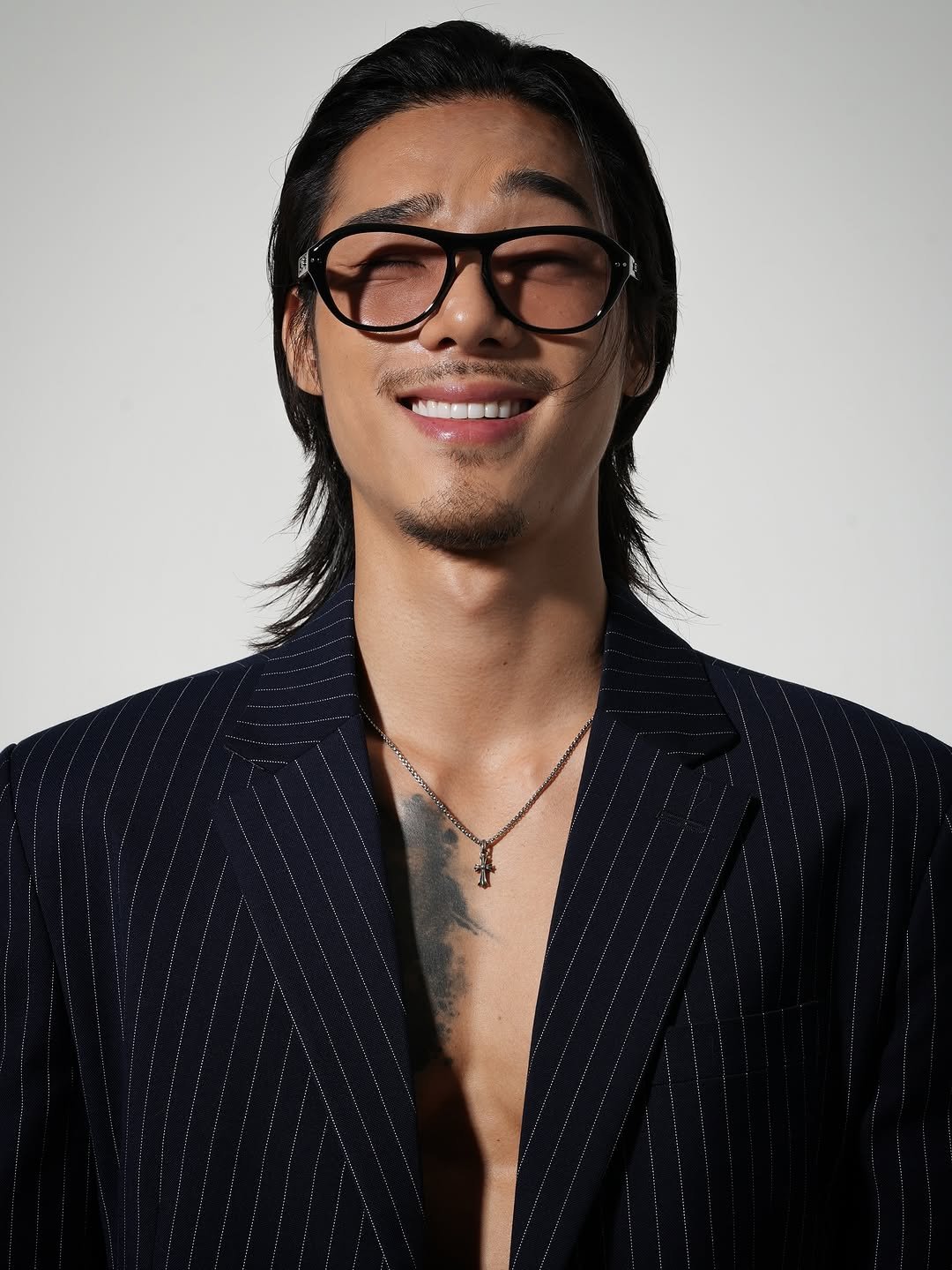 Photo by 비 르 on September 18, 2025. May be an image of 1 person, hair, eyeglasses, bolo tie and text.