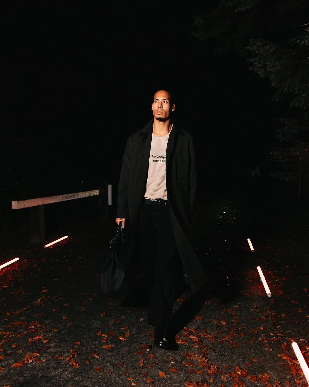 Photo by Virgil on November 11, 2025. May be an image of standing, duffle coat, overcoat, suit, blazer and text.