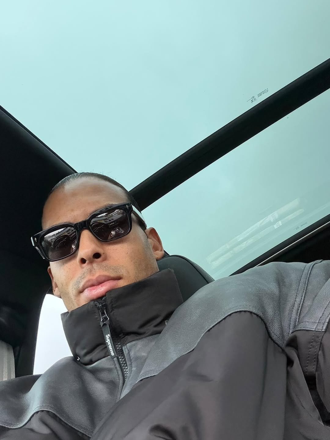 Photo by Virgil on December 30, 2025. May be a selfie of parka, seatbelt, sunglasses and text.