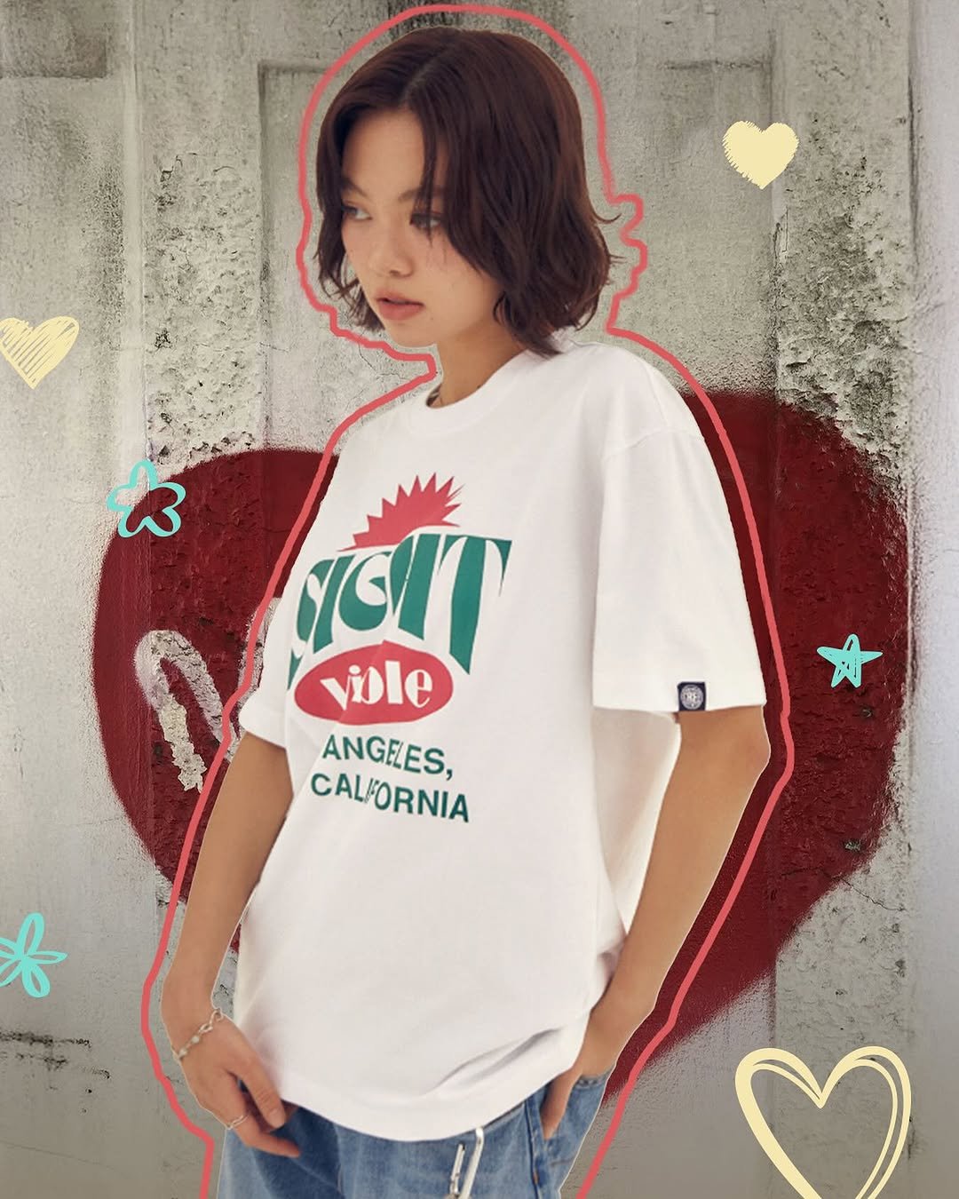 Photo by 비전스트릿웨어 on August 24, 2025. May be an image of 1 person, heart, top and text that says 'GIT viole ANGELES, CALFORNIA f ما'.