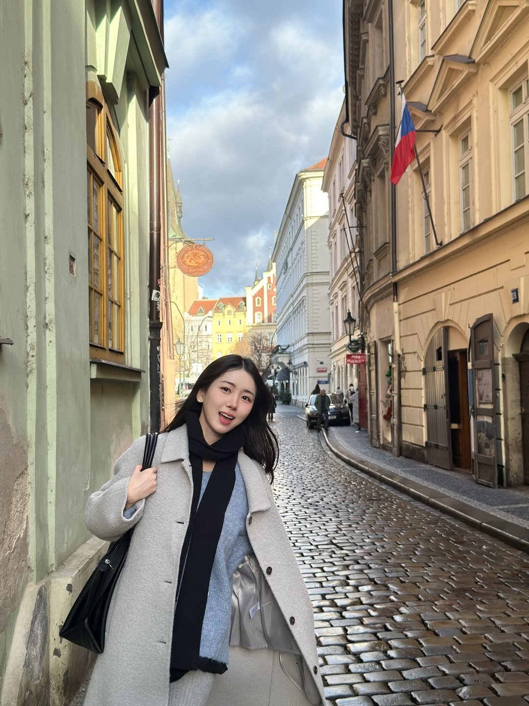 Photo by 박민정 Minjeong Park on December 24, 2025. May be an image of overcoat, parka, street and text.