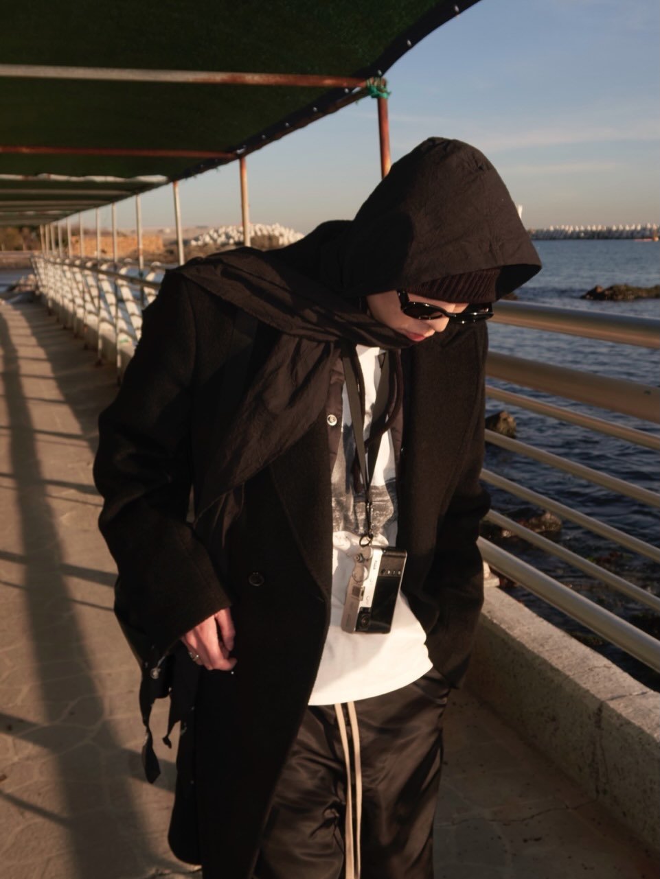 Photo by 강승윤 KANGSEUNGYOON on March 09, 2026. May be an image of duffle coat, overcoat, parka, sweatpants and text.