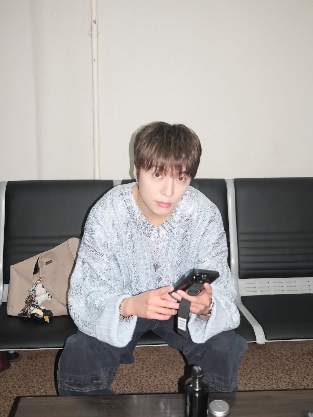 Photo by 강승윤 KANGSEUNGYOON on March 11, 2026. May be an image of one or more people, phone, top and text.