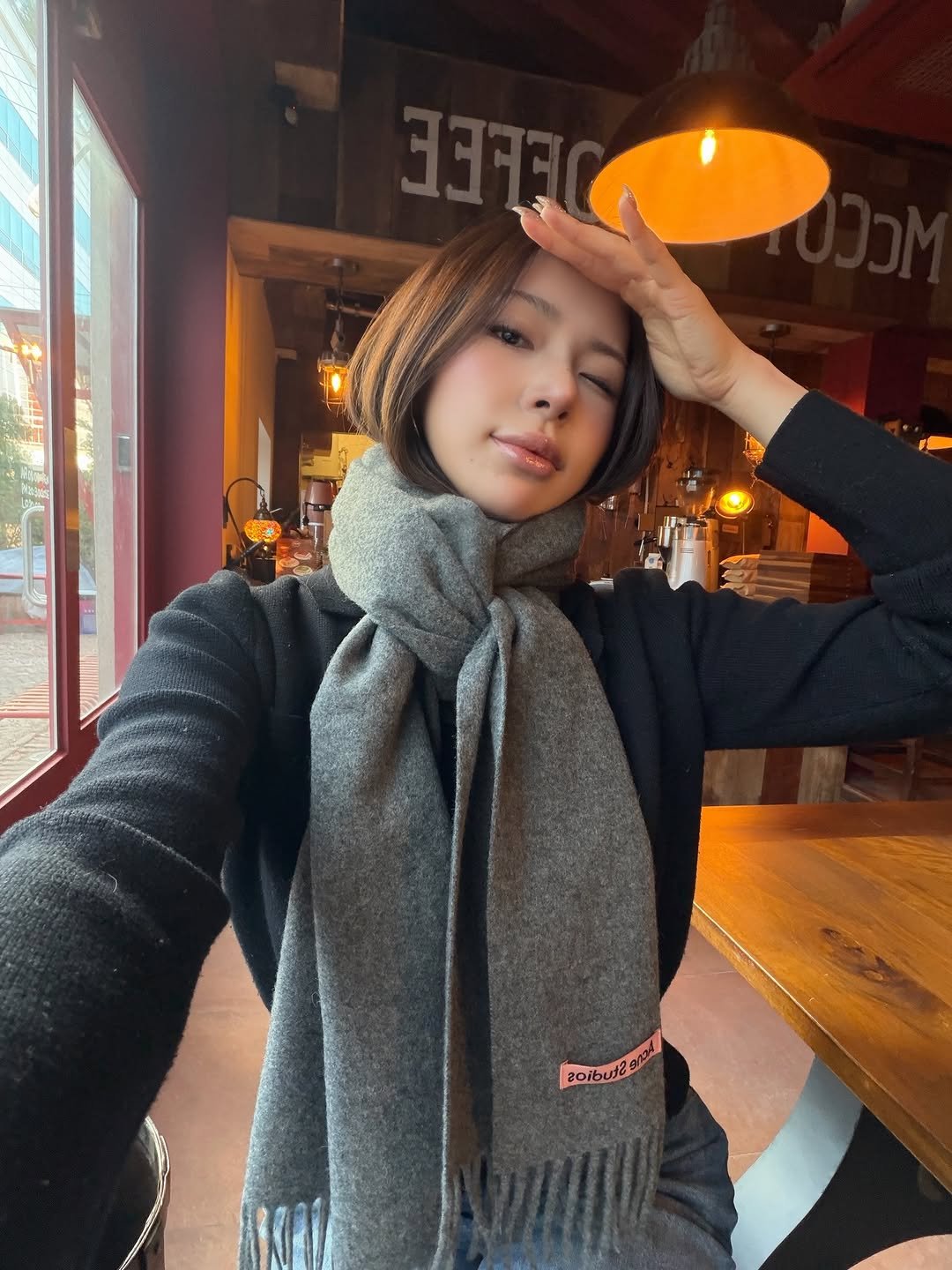 Photo by swan on December 30, 2025. May be an image of one or more people, hair, scarf, duffle coat, turtleneck, parka and text.