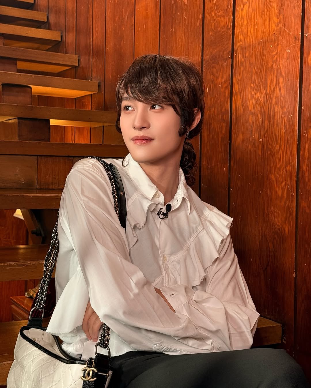 Photo shared by WayV on February 17, 2026 tagging @yangyang_x2. May be an image of bolo tie and text.