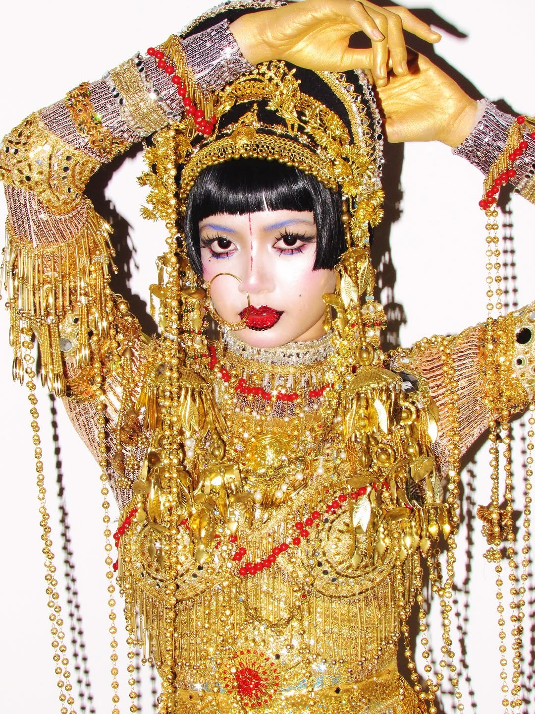 Photo shared by LLOUD on November 01, 2025 tagging @lalalalisa_m. May be pop art of one or more people, makeup, headdress, costume and text.