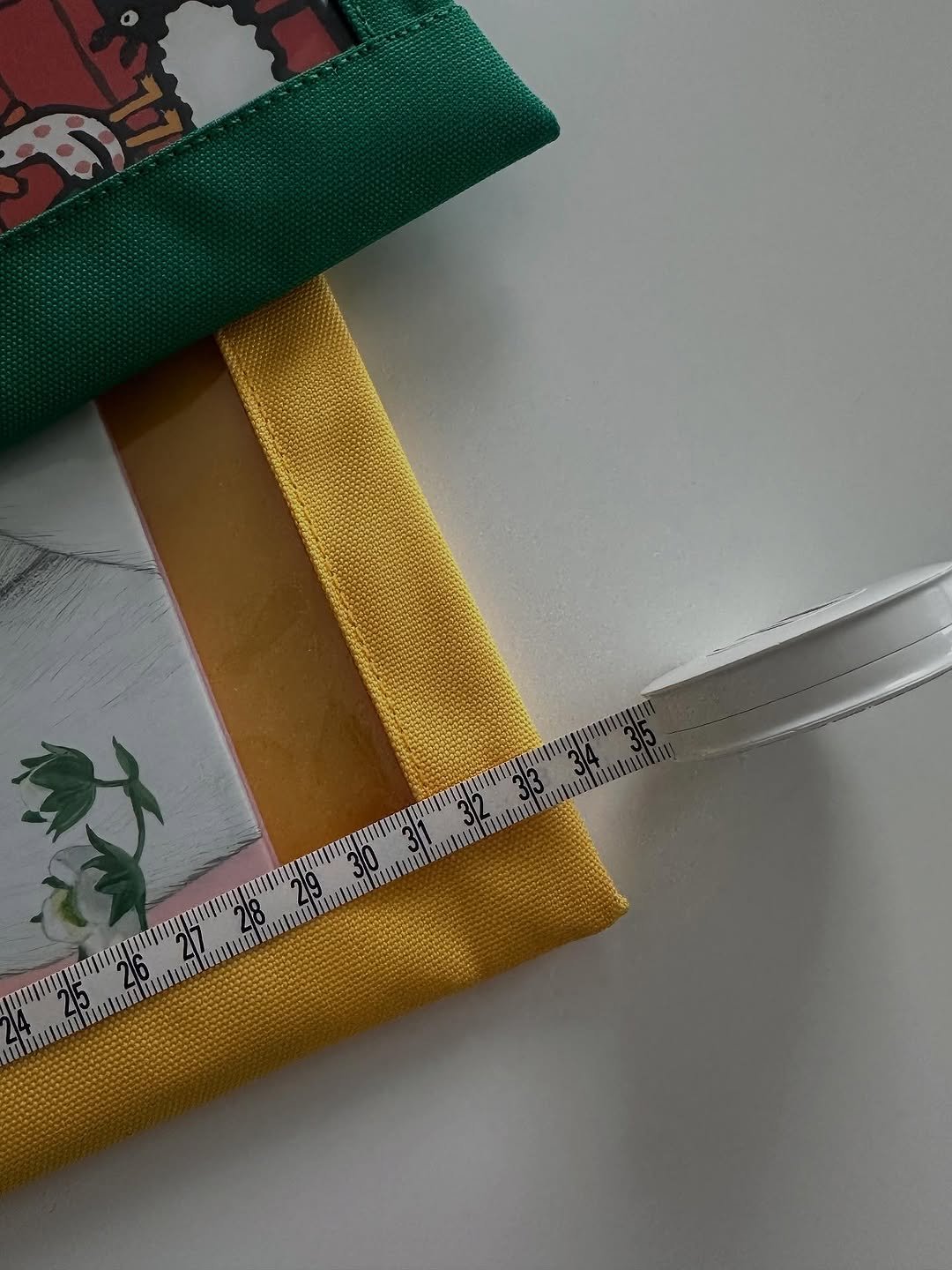 Photo by 웰컴준 𝗜 김유정 on November 11, 2025. May be an image of book, measuring stick, ruler, pencil case, stitching and text.