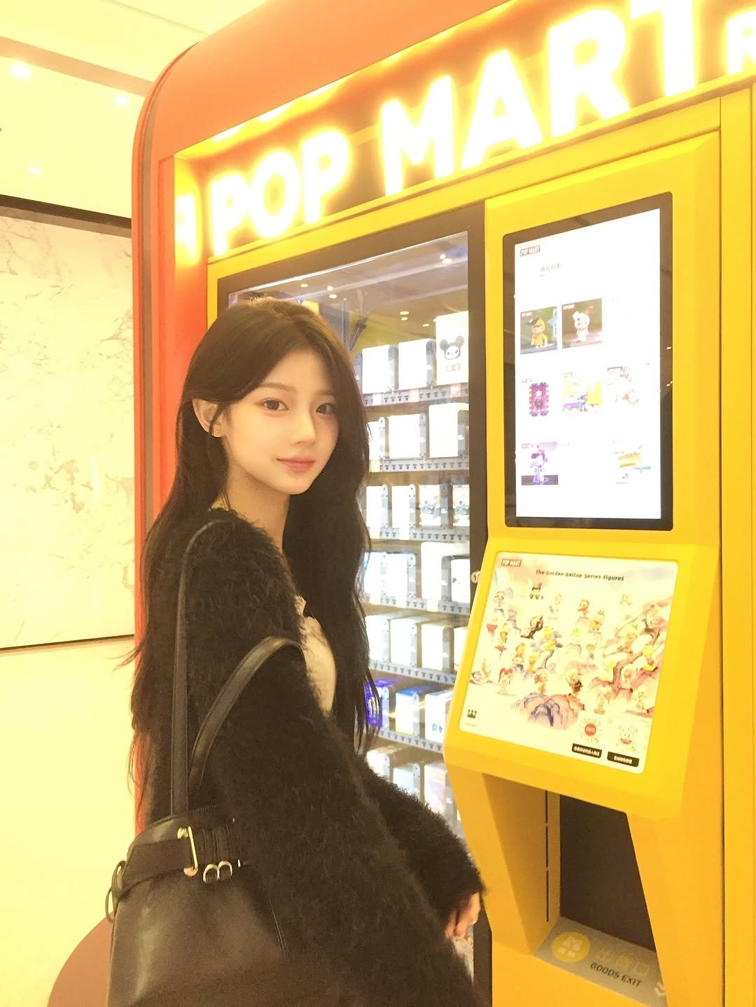 Photo by 민경 on February 20, 2026. May be an image of duffle coat, vending machine, purse and text.